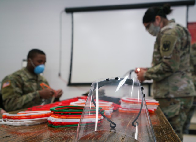 Soldiers with the 18th Field Artillery Brigade, assemble face shields at Fort Bragg, N.C., on April 15, as part of Operation Dragon Mask. Units from across Fort Bragg were repurposed to create face masks, face shields, and other personal protective equipment to be distributed as part of the COVID-19 response. (U.S. Army Photo by Sgt. Liem Huynh)