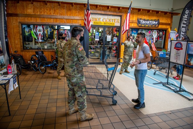 FORT BENNING, Ga. – Soldiers assigned to courtesy patrol duty at the Fort Benning commissary April 15 check would-be shoppers for proper identification cards and for whether they are wearing face masks or other face coverings, a recent...