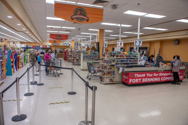 FORT BENNING, Ga. – Patrons and employees wear masks or other face coverings inside the Fort Benning commissary April 15 in keeping with a recent Department of Defense directive requiring masks or other face coverings as a precaution against the...