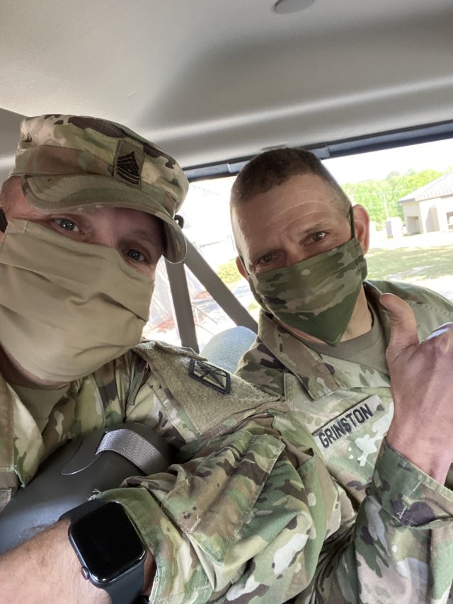 Sgt. Maj. of the Army Michael A. Grinston and Post Command Sgt. Maj. Jerimiah Gan demonstrate how to wear face coverings if social distancing cannot be maintained. Military personnel may wear civilian face masks as long as they are black, brown,...