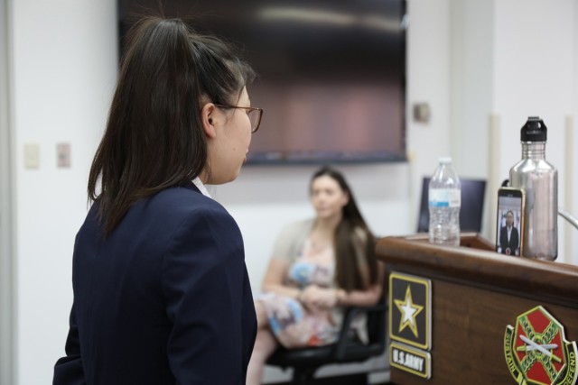 Aika Davis, a junior at Zama American Middle High School, rehearses her essay by watching herself on her cellphone screen before preparing to recite it to a panel of judges via video conference April 9 at Camp Zama, Japan, during the Boys & Girls...