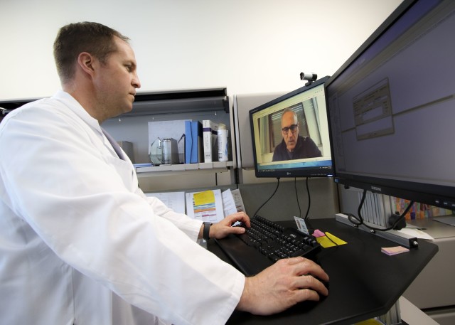 U.S. Air Force Lt. Col. Brendt Feldt, a surgeon at Landstuhl Regional Medical Center’s Ear, Nose and Throat Clinic, conducts a virtual health appointment via synchronous video, April 7. Virtual Health utilization has increased more than five times during COVID-19 operations at LRMC, allowing patients, providers and support staff to continue delivering high-quality patient care virtually while following recommended physical distancing measures to minimize contact.