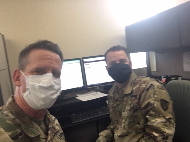 U.S. Army Col. Joseph Ritter, left, the command inspector general of Army Installation Management Command, and Master Sgt. Adam Pitler, the assistant inspector general, take a selfie during the virtual World Wide Inspector General Conference from their office at Joint Base San Antonio, Texas, April 14, 2020. (U.S. Army photo courtesy of Col. Joseph Ritter)