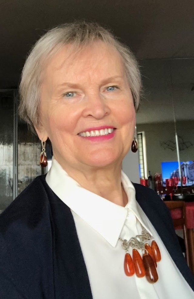 Marija Fine, wears an amber necklace and earrings her Aunt Leonora gave her. Her aunt received the ensemble, made from fossilized Baltic amber trees, for her 50th birthday.