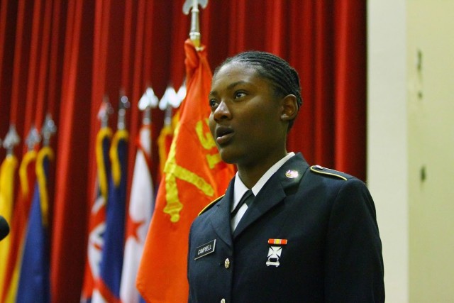 Pvt. Solange Campbell, A/1-31st FA, introduces herself April 17, 2020, during Basic Combat Training graduation at Cache Creek Chapel. She was one of 195 Soldiers to graduate in Class No. 22-20.