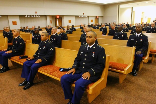Soldiers in A Battery, 1st Battalion, 31st Field Artillery maintain spacing as they wait for their graduation ceremony to begin April 17, 2020, at Cache Creek Chapel.