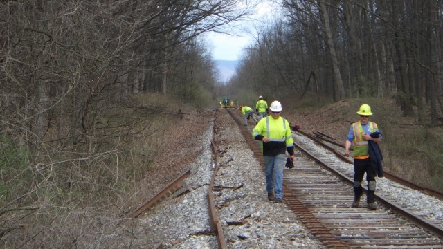 Track workers replacing a portion of the existing LEMC rail line. The 80lb rail pictured here is scheduled to be replaced with a more durable 115lb rail. A more modern freight rail capability will provide LEMC with the ability to safely and...