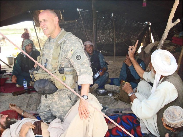 Army Col. Dr. Michael Zapor, a staph infectious diseases physician at Walter Reed National Military Medical Center, treats local citizens during his 2010 tour in Afghanistan as a battalion surgeon with the 82nd Airborne Division.