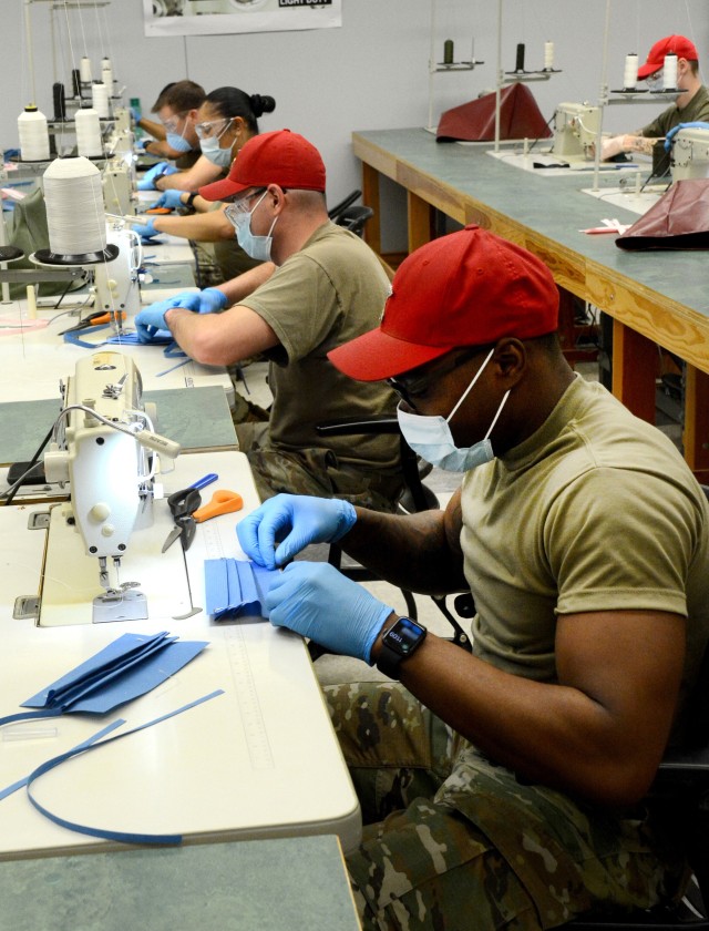 FORT LEE, Va. -- Aerial Delivery and Field Services Department instructors and cadre use the light-duty sewing machines in maintenance room 250 to sew surgical masks for Kenner Army Health Clinic and cloth face coverings for cadre around Fort Lee...