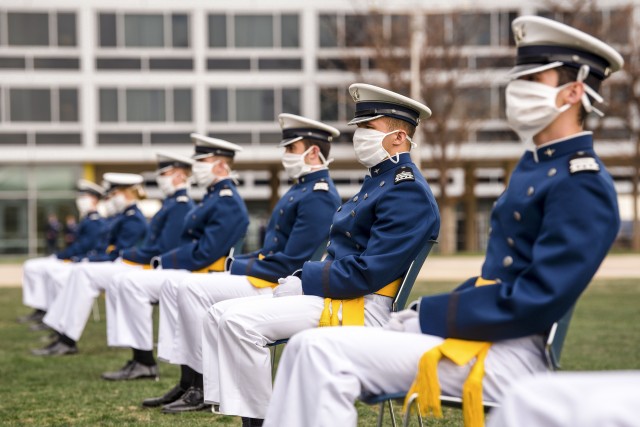 Cadets wearing masks for protection listen to the speaker’s opening remarks during the celebration of U.S. Air Force Academy's Class of 2020 Graduation Ceremony at the Air Force Academy in Colorado Springs, Colo., April 18, 2020....
