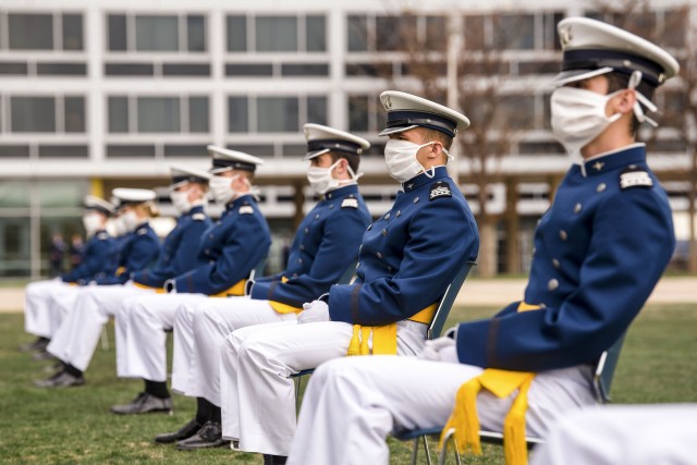 Cadets wearing masks for protection listen to the speaker’s opening remarks during the celebration of U.S. Air Force Academy&#39;s Class of 2020 Graduation Ceremony at the Air Force Academy in Colorado Springs, Colo., April 18, 2020. Nine-hundred-sixty-seven cadets crossed the stage to become the Air Force/Space Force’s newest second lieutenants.