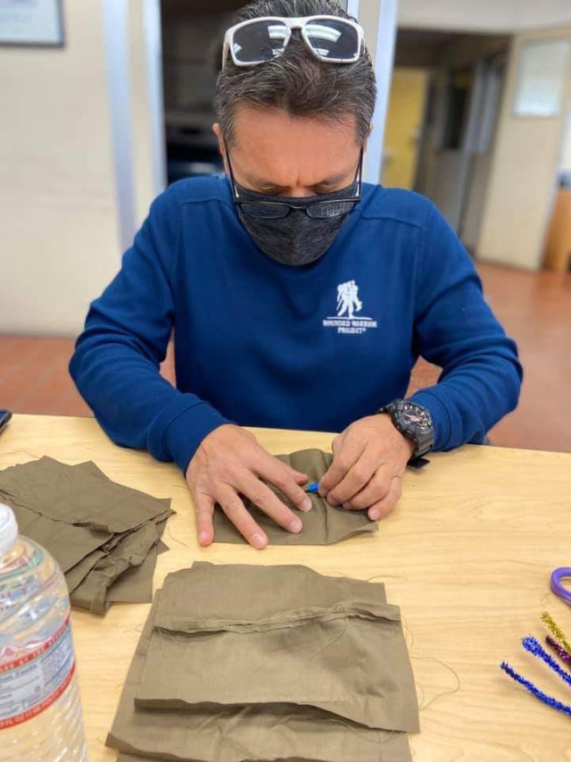 1st Sgt. Florentino Lerma, first sergeant of Public Health Activity-San Diego, sews together a cloth face covering at the Camp Pendleton Branch Veterinary clinic, April 11, 2020. In response to the COVID-19 pandemic and Secretary of Defense...
