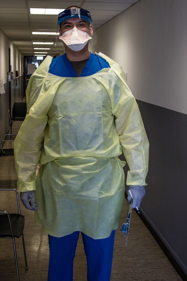 U.S. Army Spc. Johnathan Ibarra, a combat medic for Wiesbaden Army Medical Clinic, stands ready to test individuals at a COVID-19 testing facility on Apr. 10, 2020 in U.S. Army Garrison-Wiesbaden, Germany. (U.S. Army photo by Sgt. Dommnique Washington, 7th Mobile Public Affairs Detachment)