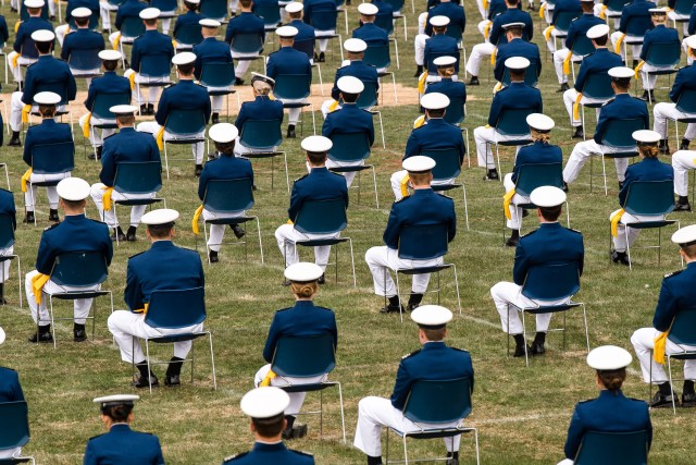 Cadets sit on the terrazzo during the U.S. Air Force Academy's Class of 2020 Graduation Ceremony at the Air Force Academy in Colorado Springs, Colo., April 18, 2020. Nine-hundred-sixty-seven cadets crossed the stage to become the Air...