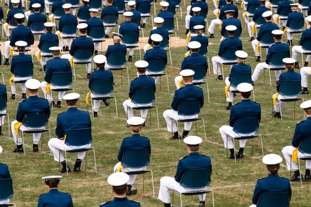 Cadets sit on the terrazzo during the U.S. Air Force Academy&#39;s Class of 2020 Graduation Ceremony at the Air Force Academy in Colorado Springs, Colo., April 18, 2020. Nine-hundred-sixty-seven cadets crossed the stage to become the Air Force/Space Force’s newest second lieutenants. 