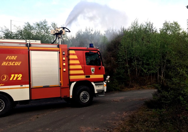 A tanker truck from the U.S. Army Garrison Rheinland-Pfalz Station 3 at Miesau Army Depot provides mutual aid to local German volunteer fire departments during a forest fire that burned approximately 125,000 sq. meters of scrub and natural debris on the forest floor approximately 5 km southeast of Sembach April 24.