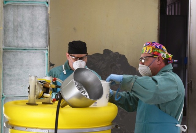 Crane Army Ammunition Activity employees prepare a production line to run test batches for manufacturing hand sanitizer. CAAA is collaborating with McAlester Army Ammunition Plant to support the Organic Industrial Base effort to fight COVID-19 and...
