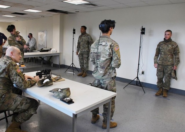 Soldiers at Fort Benning, Ga., take the temperature of trainees using sensors in a modified version of the Integrated Visual Augmentation System, known as IVAS googles.