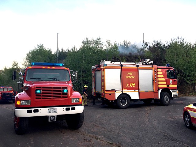 Tanker trucks from the U.S. Army Garrison Rheinland-Pfalz Fire Station 2 at Sembach and Station 3 at Miesau Army Depot, provide mutual aid to local German volunteer fire departments during a forest fire that burned approximately 125,000 sq. meters of scrub and natural debris on the forest floor 5 km southwest of Sembach April 24.