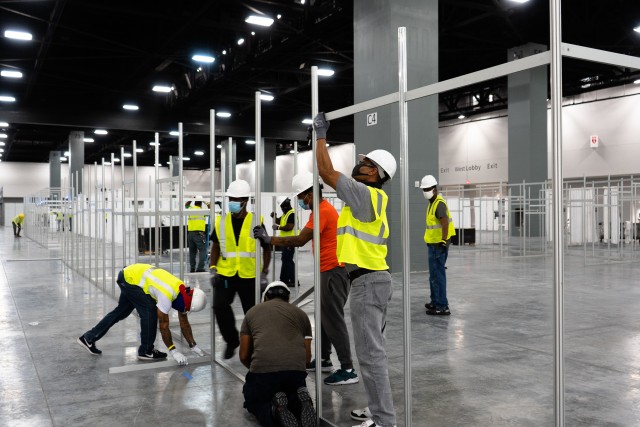 The Miami Beach Convention Center is now a 24 hour construction site crews work at a steady pace to install ICU and Acute Care pods....