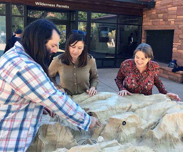 Sacramento District's Darrin Rummel, Corrie Stetzel and Lori Schultz look over a 3D model of Zion and its many canyons in order to get a sense of how the tributaries feed into the Virgin River.