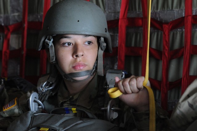 Pvt. Angelica Gonzalez, Charlie Company, 262nd Quartermaster Battalion, holds on to her static line as she awaits instructions for a jump aboard a C-130 aircraft flying above Fort Pickett’s Blackstone Army Airfield April 22. She was among 60 rigger students and others who participated in the Quartermaster School’s first airborne operation since they were grounded in early March due to coronavirus concerns.