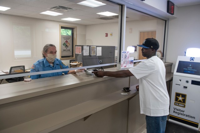 FORT BENNING, Ga. – At Fort Benning's Lindsey Creek Visitor Control Center April 24, a visitor asking to be allowed onto the post shows a pass he'd just printed from a self-service machine set up for that purpose. Visits to the post for social,...