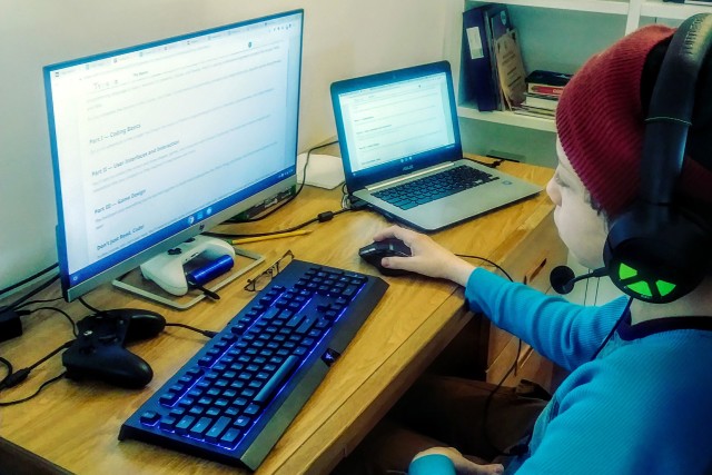 A student who attends a Department of Defense Education Activity school in Vicenza, Italy, completes classwork at home using a computer, April 28, 2020.