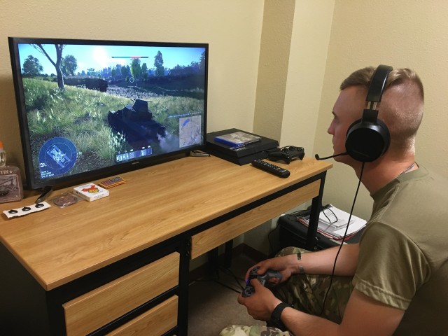 Sgt. David Ose, a section leader in D Troop, 6th Squadron, 9th Cavalry Regiment, 3rd Brigade Combat Team,1st Cavalry Division plays an online game that the unit is using to help maintain readiness while protecting the force. The Troop uses it to train on tactics, maneuver and communications. (Army photo by Capt. Mike Manougian)