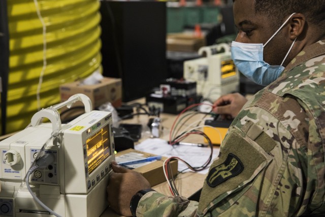 Army Sgt. Christopher Holmes, a biomedical equipment specialist with the 807th Medical Command, tests and calibrates a Propaq patient monitor while conducting preventive maintenance and repairs on medical equipment at the Medical Equipment Concentration Site for the 88th Readiness Division in Ogden, Utah, April 17, 2020. Soldiers and civilians working and volunteering at MECS 88 maintain and repair medical equipment in preparation to deploy it in support of Army Reserve medical units responding to the COVID-19 pandemic. (U.S. Army Reserve photo by Sgt. Jeremiah Woods)