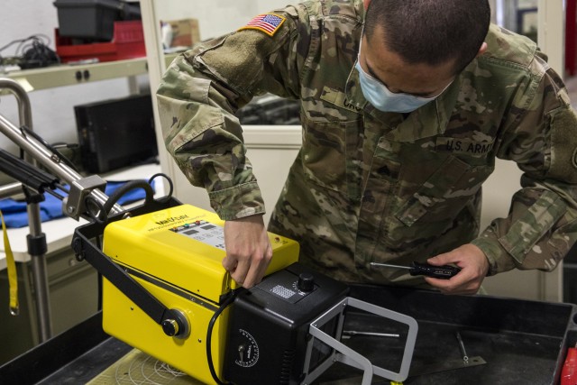 Army Sgt. Shengyuan Cao, a biomedical equipment specialist with the 807th Medical Command, services a Portable Xray Machine while conducting preventive maintenance and repairs on medical equipment at the Medical Equipment Concentration Site for the 88th Readiness Division in Ogden, Utah, April 17, 2020. Soldiers and civilians working and volunteering at MECS 88 maintain and repair medical equipment in preparation to deploy it in support of Army Reserve medical units responding to the COVID-19 pandemic. (U.S. Army Reserve photo by Sgt. Jeremiah Woods)