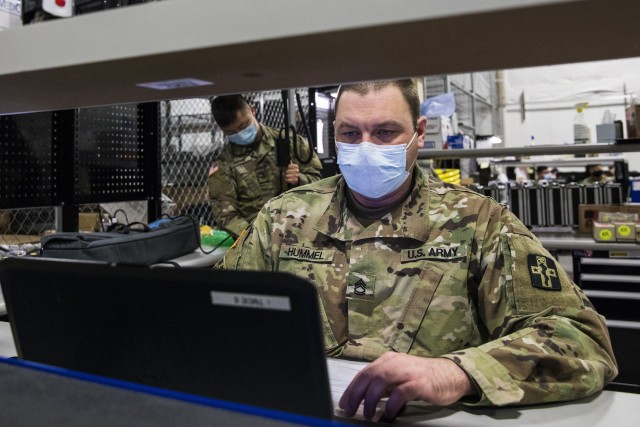 Army Sgt. 1st Class George Hummel, a biomedical equipment specialist with the 807th Medical Command, inputs data while conducting preventive maintenance and repairs on medical equipment at the Medical Equipment Concentration Site for the 88th...