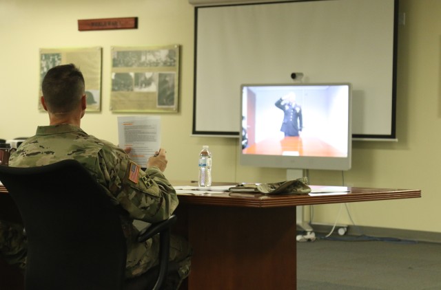 Command Sgt. Maj. David Pakulak, the senior enlisted leader of the 5th Battalion, 7th Cavalry Squadron, 1st Armored Brigade Combat Team, 3rd Infantry Division, prepares to start virtual board proceedings at a brigade level Non-commissioned...