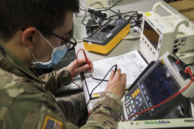Army Spc. Jessy Becerra, a biomedical equipment specialist with the 807th Medical Command, tests and calibrates a Propaq patient monitor while conducting preventive maintenance and repairs on medical equipment at the Medical Equipment Concentration Site for the 88th Readiness Division in Ogden, Utah, April 17, 2020. Soldiers and civilians working and volunteering at MECS 88 maintain and repair medical equipment in preparation to deploy it in support of Army Reserve medical units responding to the COVID-19 pandemic. (U.S. Army Reserve photo by Sgt. Jeremiah Woods)