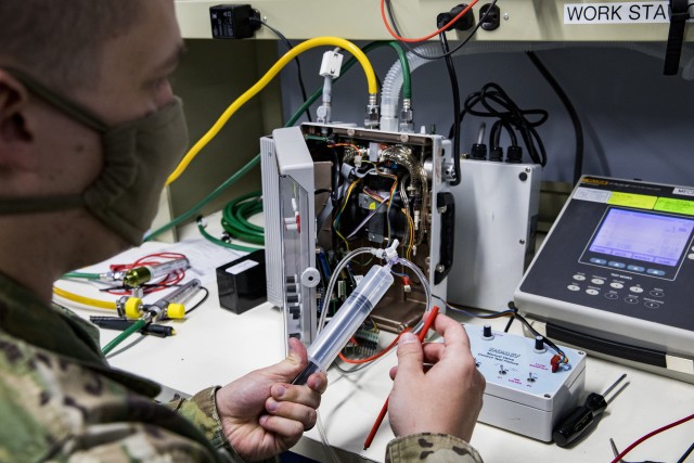 Army Warrant Officer Candidate Korey Rasmussen, training to be a health services maintenance technician with the 971st Medical Logistics Company, 807th Medical Command, conducts service maintenance on an Impact 754 Ventilator at the Medical Equipment Concentration Site for the 88th Readiness Division in Ogden, Utah, April 17, 2020. Soldiers and civilians working and volunteering at MECS 88 maintain and repair medical equipment in preparation to deploy it in support of Army Reserve medical units responding to the COVID-19 pandemic. (U.S. Army Reserve photo by Sgt. Jeremiah Woods)