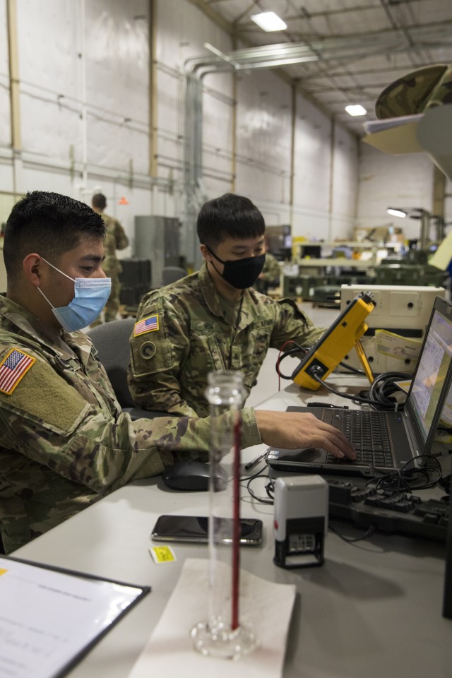 Army Sgt. Jung Huh, and Spc. Edwin Nicolas, both biomedical equipment specialists with the 807th Medical Command, test a Fiber Optic Endoscope Instrument Light while conducting preventive maintenance and repairs on medical equipment at the Medical Equipment Concentration Site for the 88th Readiness Division in Ogden, Utah, April 17, 2020. Soldiers and civilians working and volunteering at MECS 88 maintain and repair medical equipment in preparation to deploy it in support of Army Reserve medical units responding to the COVID-19 pandemic. (U.S. Army Reserve photo by Sgt. Jeremiah Woods)