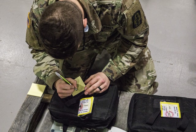Army Sgt. Kevin David, a biomedical equipment specialist with the 807th Medical Command, notes the serial number of a dental handpiece while conducting preventive maintenance and repairs on medical equipment at the Medical Equipment Concentration...