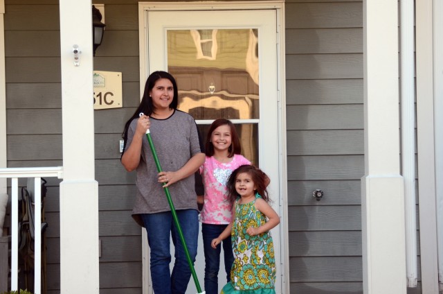 Brittny Luckenbill with daughters Skylar and Mason stand in front of their quarters as they complete some spring cleaning April 28 in Fort Jackson Housing. Luckenbill is the wife of Staff Sgt. Nate Luckenbill a drill sergeant with 1st Battalion,...
