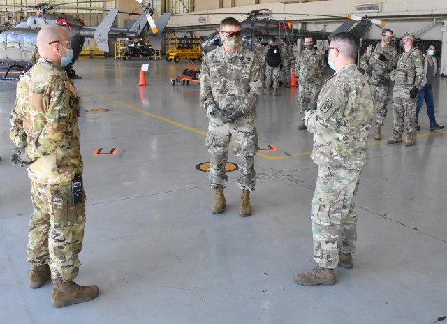 Army Chief of Staff Gen. James C. McConville, center, speaks with Soldiers during a visit to the Joint Readiness Training Center at Fort Polk, La., to see how the center is adapting in preparation for training in a COVID-19 environment.