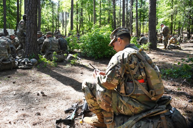 Sgt. Michael Murray, assigned to 2nd Battalion, 39th Infantry Regiment, cleans his weapon before completing The Forge at Fort Jackson, South Carolina. 'I have a wild career,' Murray said. 'I have 17 years of active duty, U.S. Army Reserve and...