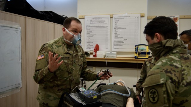 U.S. Army Capt. James Schofield, assigned to the 4th Squadron, 2d Cavalry Regiment, explains the differences between the types of respirators available for medical providers during training in Rose Barracks, Germany, April 21, 2020. The 2d Cavalry...