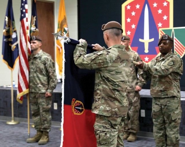 FORT CARSON, Colo. — Col. James Dooghan, commander, 4th Security Force Assistance Brigade, unveils the brigade colors at the 4th SFAB activation ceremony April 28, 2020. The 4th SFAB’s mission is to train, advise, assist, enable and accompany...