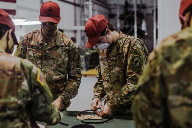 In the wake of the COVID-19 epidemic in Northern Italy, U.S. Army parachute riggers assigned to the 601st Quartermaster Company, 173rd Brigade Support Battalion, 173rd Airborne Brigade cut materials and sew face mask prototypes made from fabric found in the standard Army parachute system in Aviano Air Base, Italy, April 28, 2020. The prototypes are meant to prepare the paratroopers for the mass production of the masks when proper materials arrive.

The 173rd Airborne Brigade is the U.S. Army's Contingency Response Force in Europe, providing rapidly deployable forces to the United States Europe, Africa and Central Command areas of responsibility. Forward deployed across Italy and Germany, the brigade routinely trains alongside NATO allies and partners to build partnerships and strengthen the alliance.

(U.S. Army photo by Spc. Ryan Lucas)