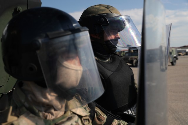 Kosovo Force maneuver battalion personnel pose in crowd and riot control gear April 28, 2020, at Camp Marechal De Lattre De Tassigny, Kosovo.
...