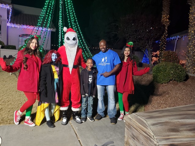Picture Previously Taken and Provided by Master Sgt. Stormy Graham Jr—Master Sgt. Stormy Graham Jr. a student with the Sergeants Major Academy Class 70 and a Big Brother Big Sister mentor experiences the Fred Loya light show in El Paso with his Little, Jo’elle, December 2019.