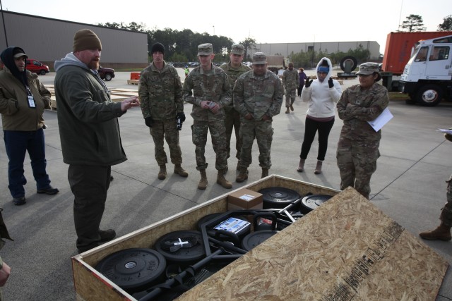 Jeremiah Sutherland (in watch cap at left), a training specialist with the Tank-automotive and Armaments Command’s Integrated Logistics Support Center, briefs a group of Fort Benning based Soldiers and civilians regarding Army Combat Fitness Test equipment accountability procedures in January.