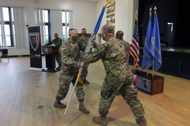 FORT GEORGE G. MEADE, Md. – Command Sgt. Maj. James Krog (right),  the outgoing senior enlisted Soldier for the 780th Military Intelligence Brigade (Cyber), relinquished his authority as the ‘keeper of the colors’ to Col. Brian Vile, the brigade commander, during a Change of Responsibility ceremony at McGill Training Center, April 24.