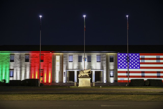 The U.S. Army Africa Headquarters Building on Caserma Ederle in Vicenza, Italy, is illuminated with the Italian and American flags May 3, 2020, as a sign of solidarity with Italy in combating the spread of the coronavirus. The ceremonial lighting marked the start of a transitional phase, announced by Italian Prime Minister Giuseppe Conte on April 26, to slowly begin reopening the country May 4. (U.S Army photo by Sgt. Jennifer Garza)
