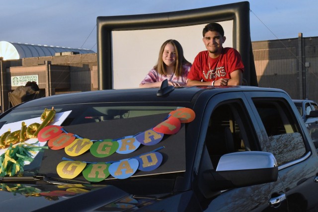 More than 150 carloads of patrons watched a drive-in movie May 1, 2020, created to honor this year’s graduating seniors. Projected onto a 40-foot inflatable screen, moviegoers were treated with popcorn, drinks and fun while parked in Fort Knox’s Main Exchange parking lot.
