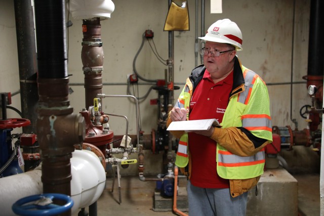 Brian Erbstosesser, fire protection engineer, U.S. Army Corps of Engineers – Omaha District, inspects the boiler room during a site assessment of a building in Omaha, Neb., the state is considering turning into an alternate care facility in the...